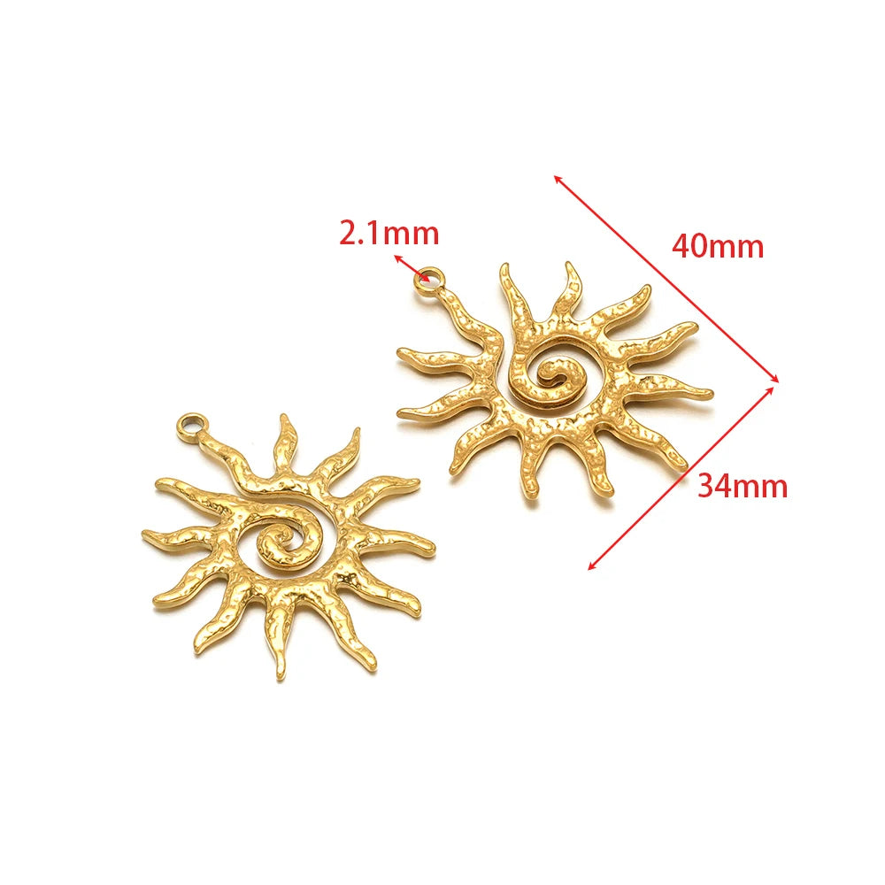Gold sunburst charm pendant with spiral center and hanging loop