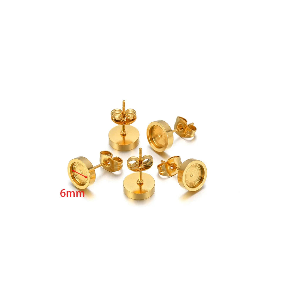 Gold-tone round stud earring bases, 6mm size marking visible, with posts and backs