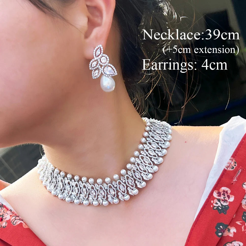 Silver-tone cubic zirconia choker necklace with pearl drop earrings, close-up