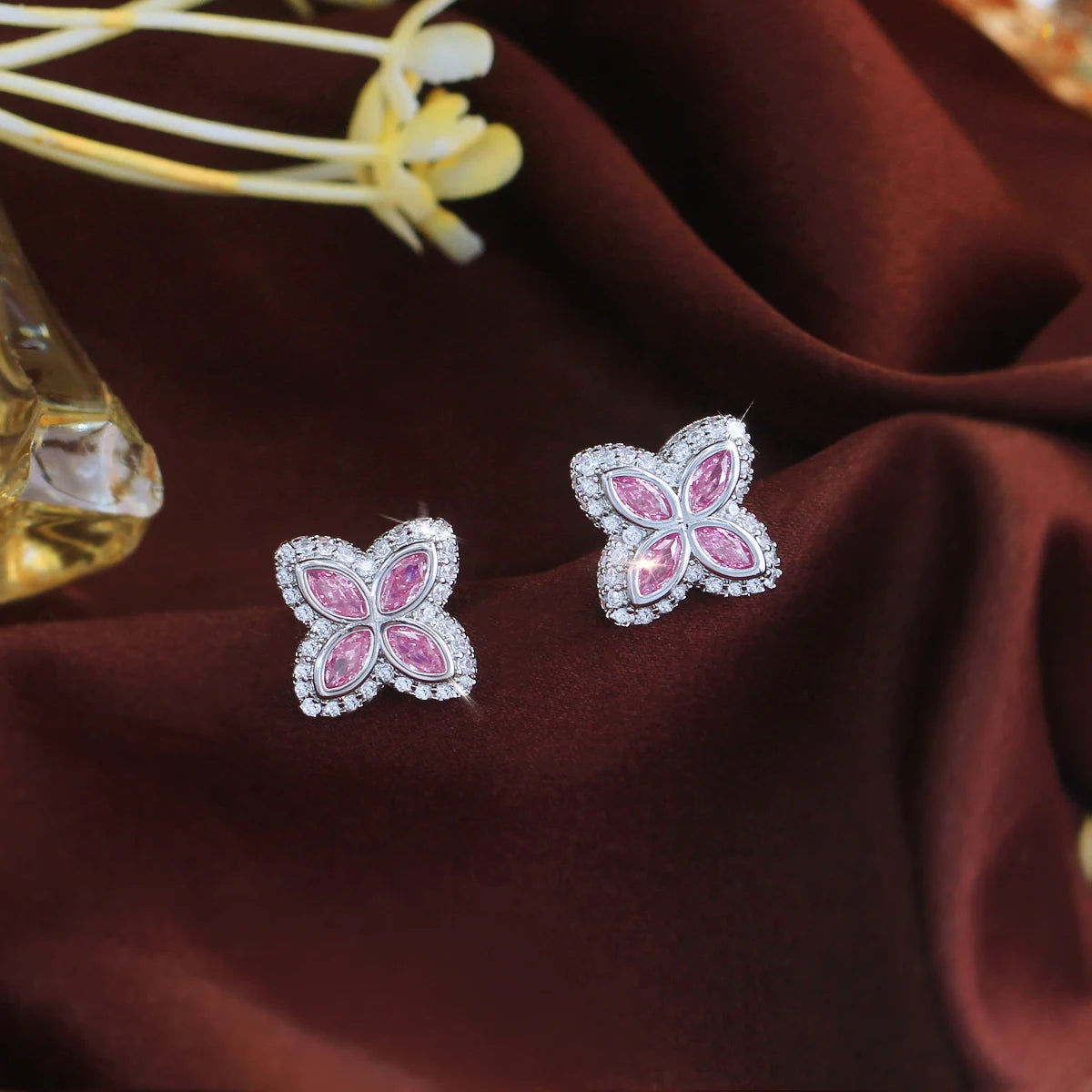 Pink cubic zircon four-leaf stud earrings with silver-tone trim