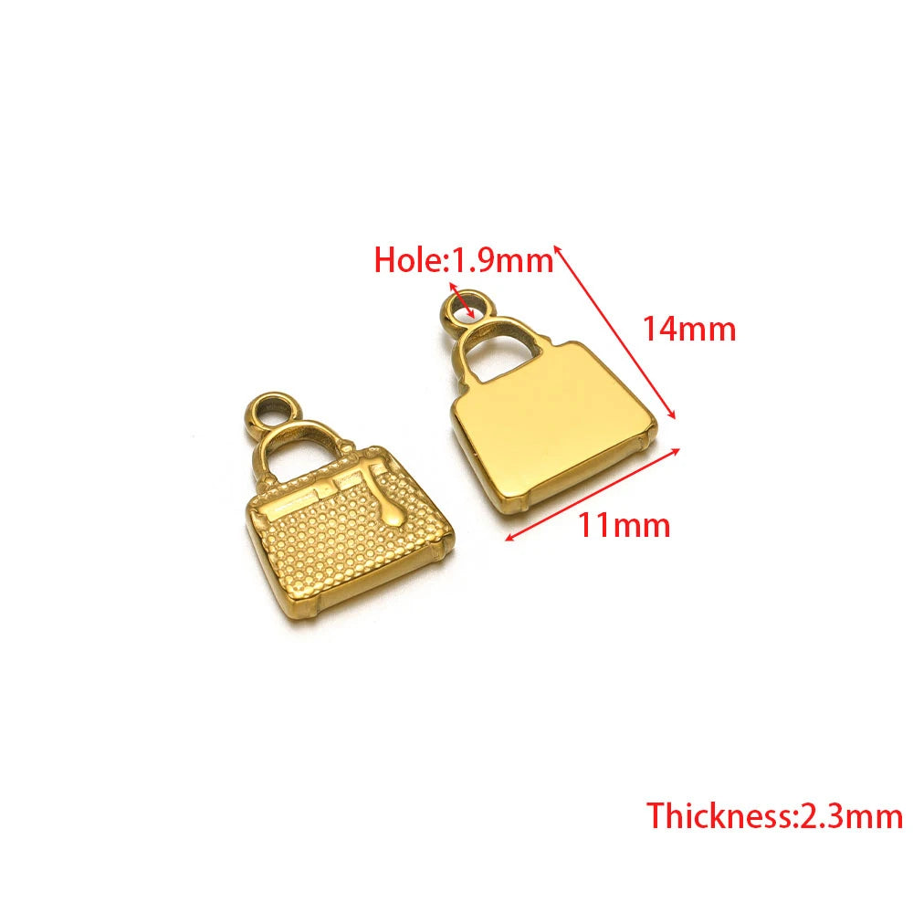 Stainless steel heart and purse charms with jump ring holes, gold-tone pair