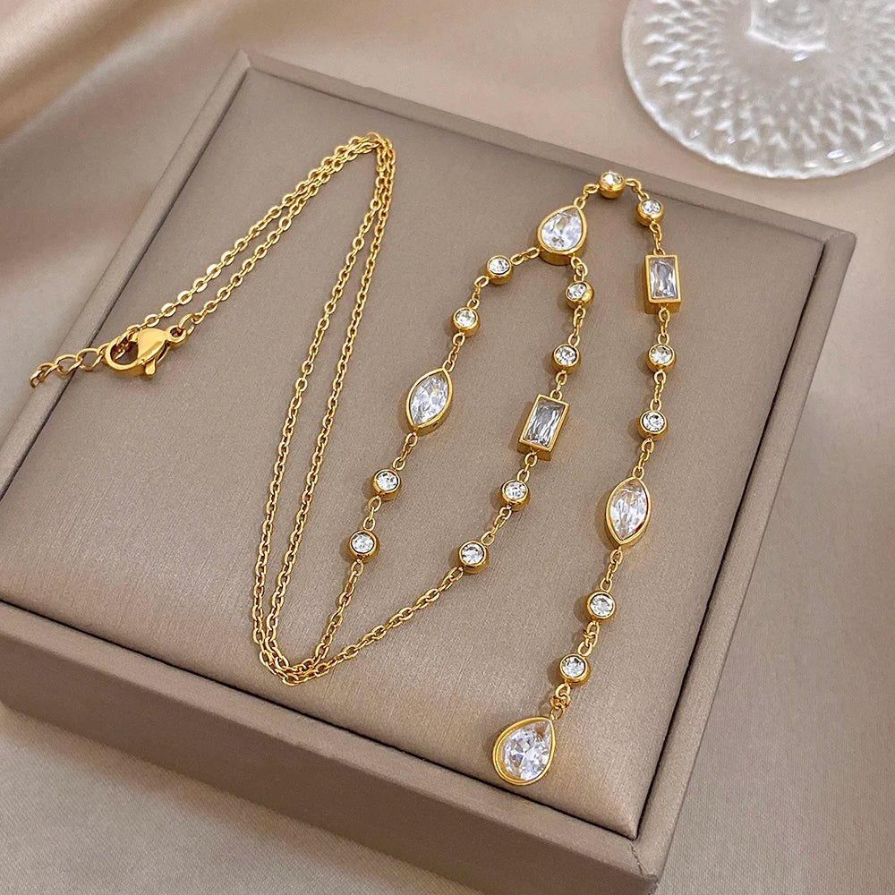 Gold-tone Y choker necklace set with oval and rectangular crystal centerpiece links
