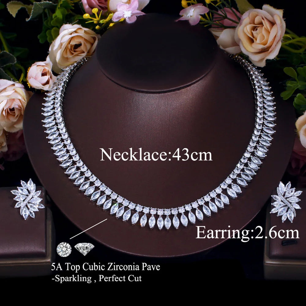 Cubic zirconia jewelry set with a leaf-shaped necklace and matching floral stud earrings
