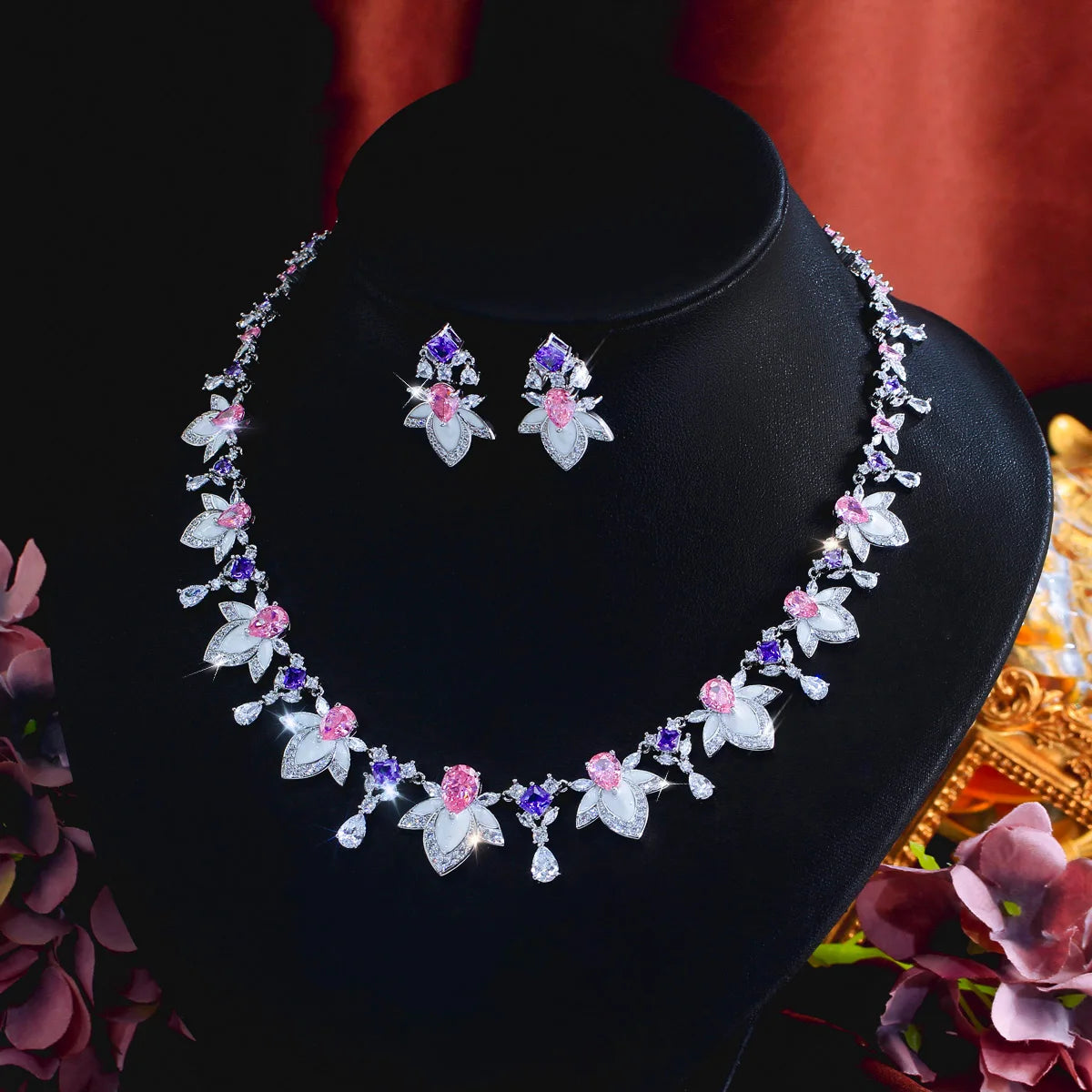 Multicolor cubic zirconia necklace and earrings set with bow-and-leaf charms, silver tone
