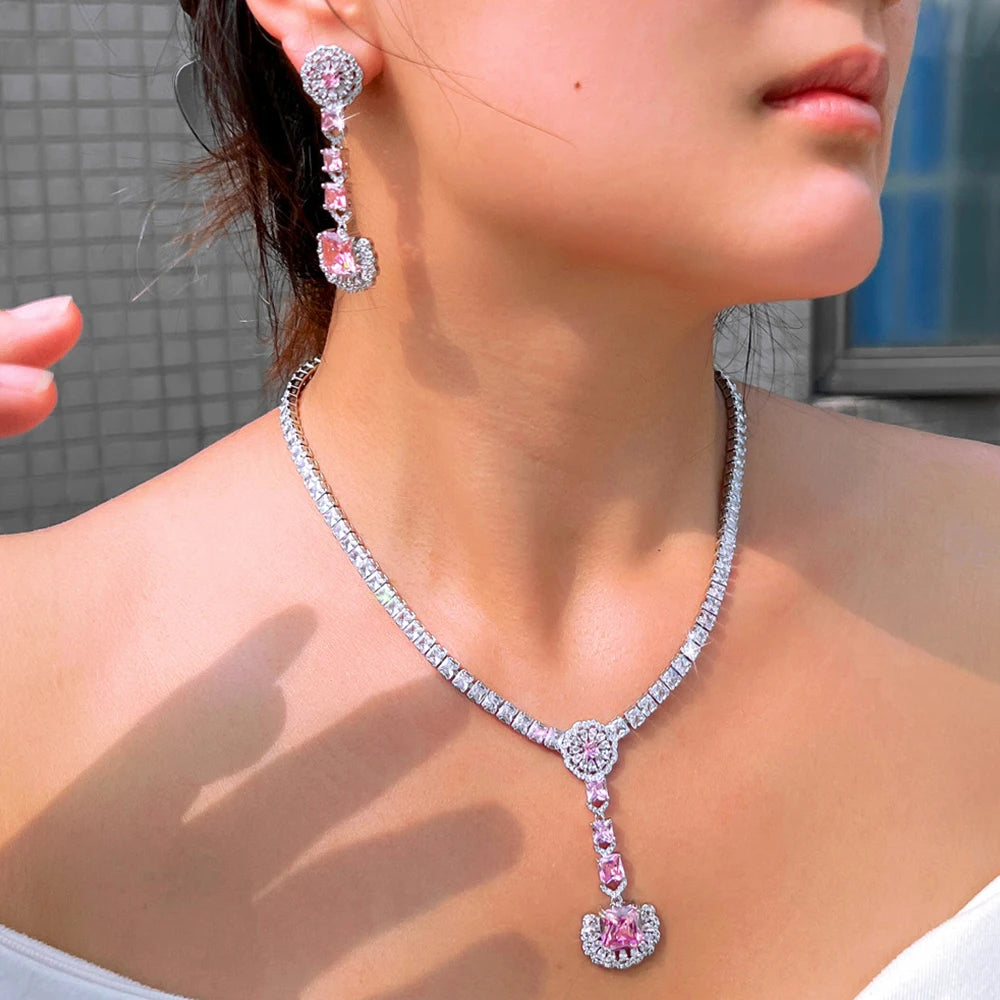 Pink zirconia drop earrings and necklace with teardrop pendant, silver-tone chain