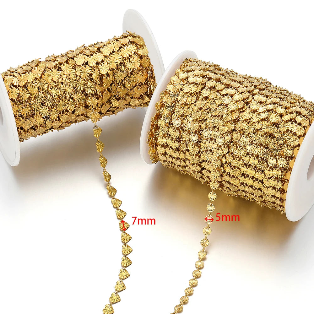 Two gold heart-shaped embossed link chains with measured links, from spools