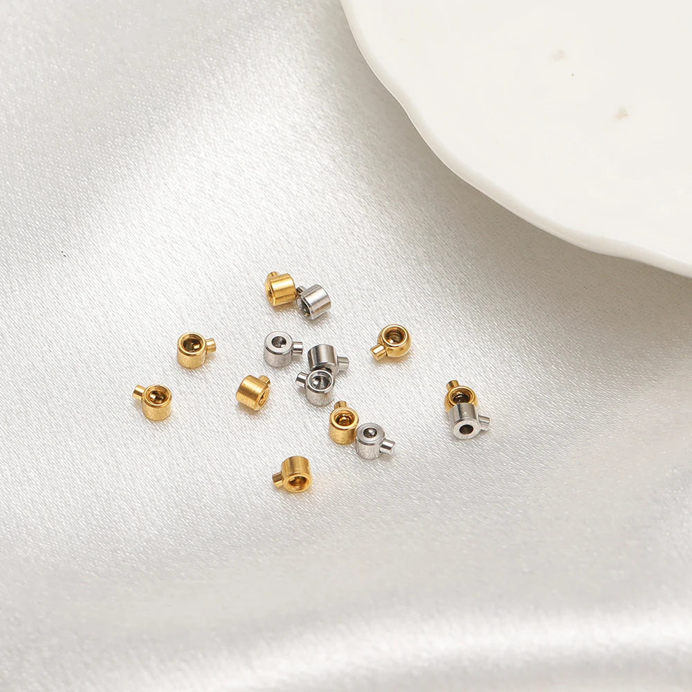 Assorted gold and silver crimp end bead stoppers, small cylindrical caps