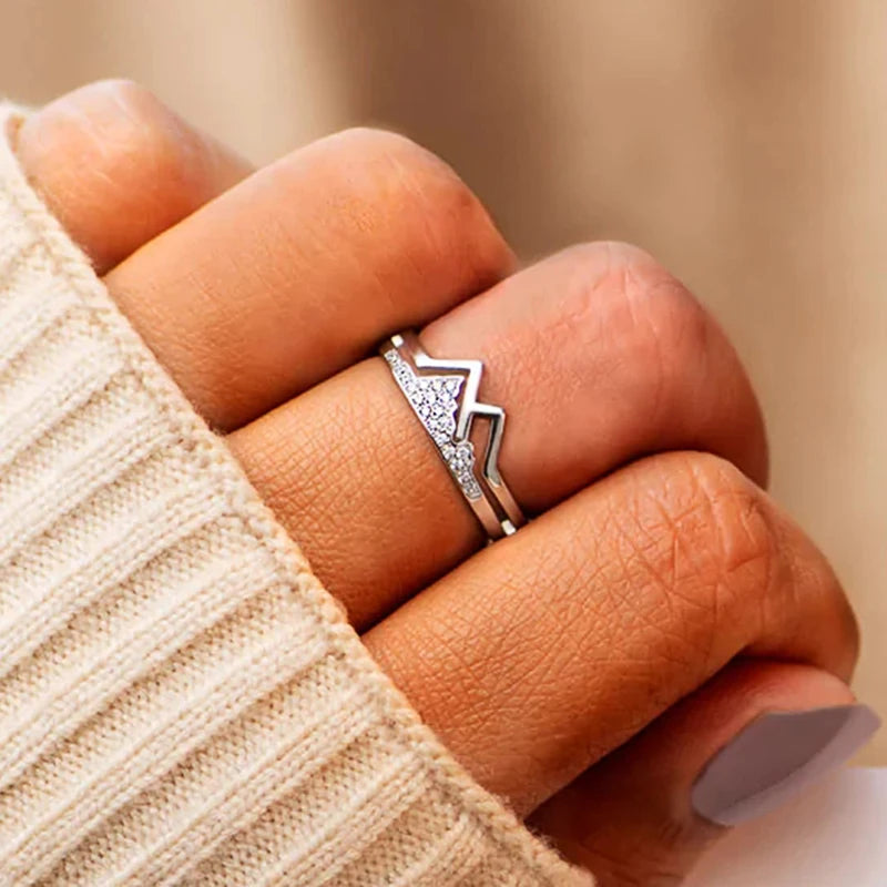 Silver-tone mountain-shaped cubic zirconia finger ring with two stacked bands