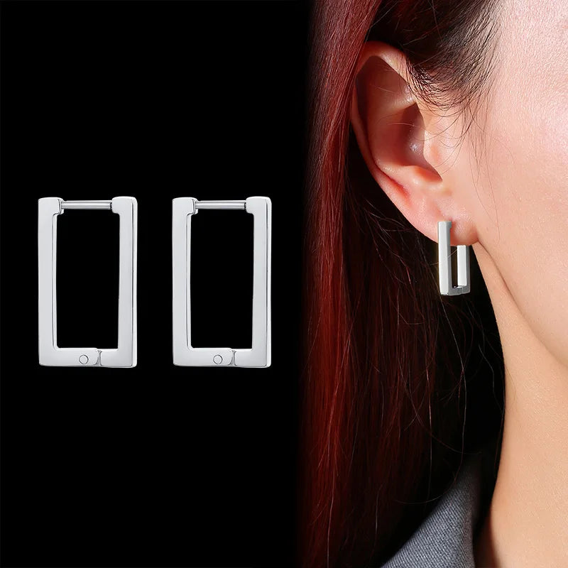 Pair of silver rectangular stainless steel hoop earrings shown worn and as a pair