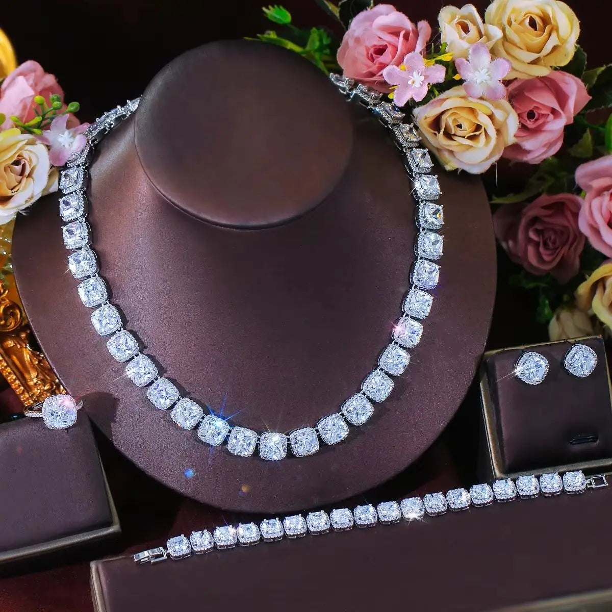 Multicolor CZ bridal jewelry set with oval tennis necklace, matching bracelet, and stud earrings