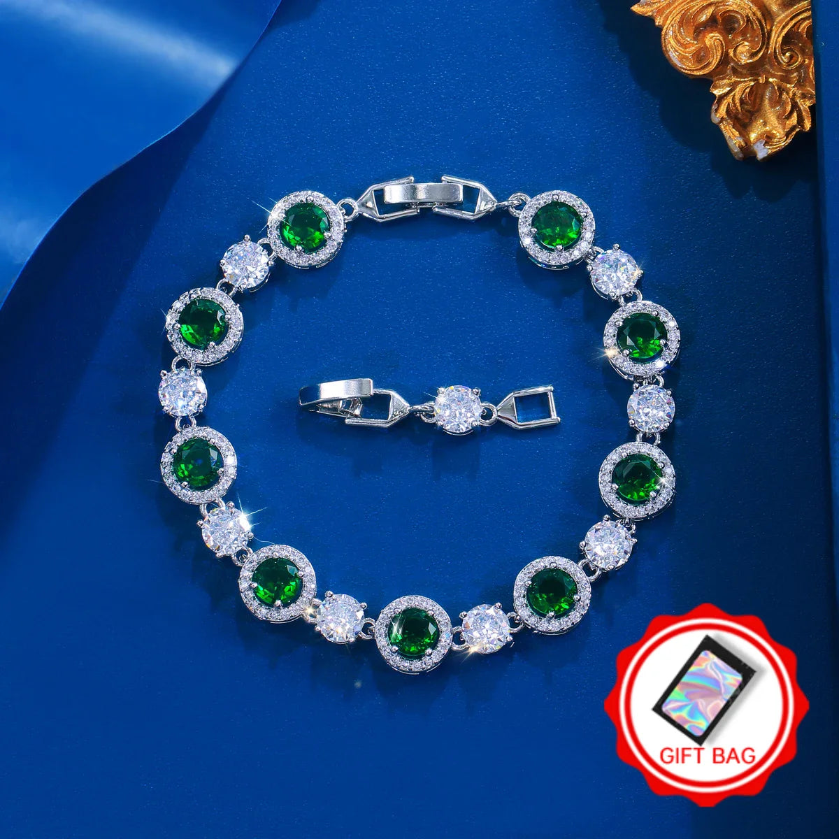 Silver-tone tennis bracelet with round green and clear cubic zirconia stones
