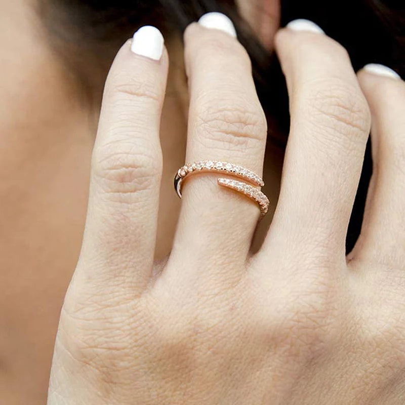 Adjustable open zirconia ring on hand, rose gold tone with two rows of round clear stones