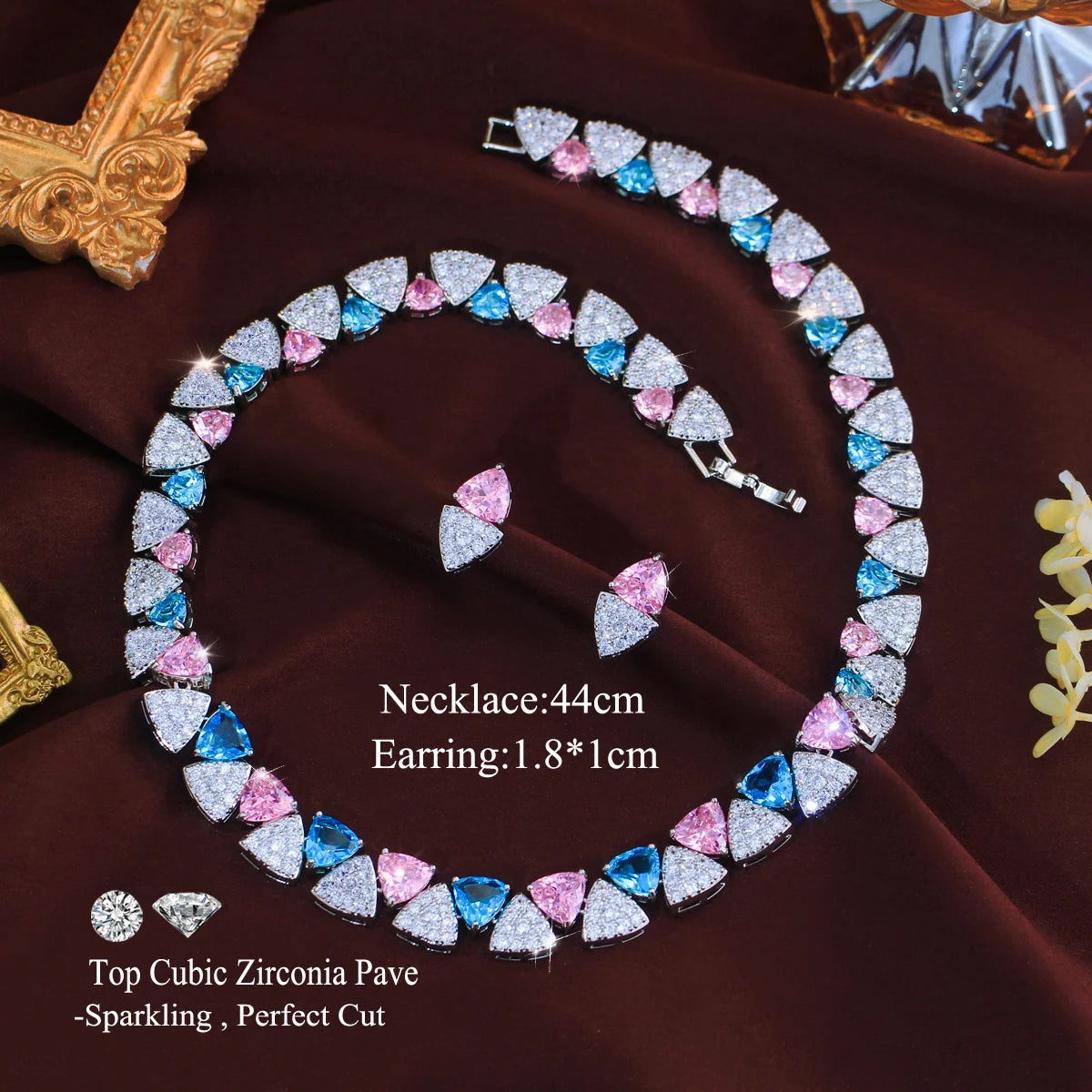 Triangle cubic zirconia necklace and earrings set in blue, pink, and white