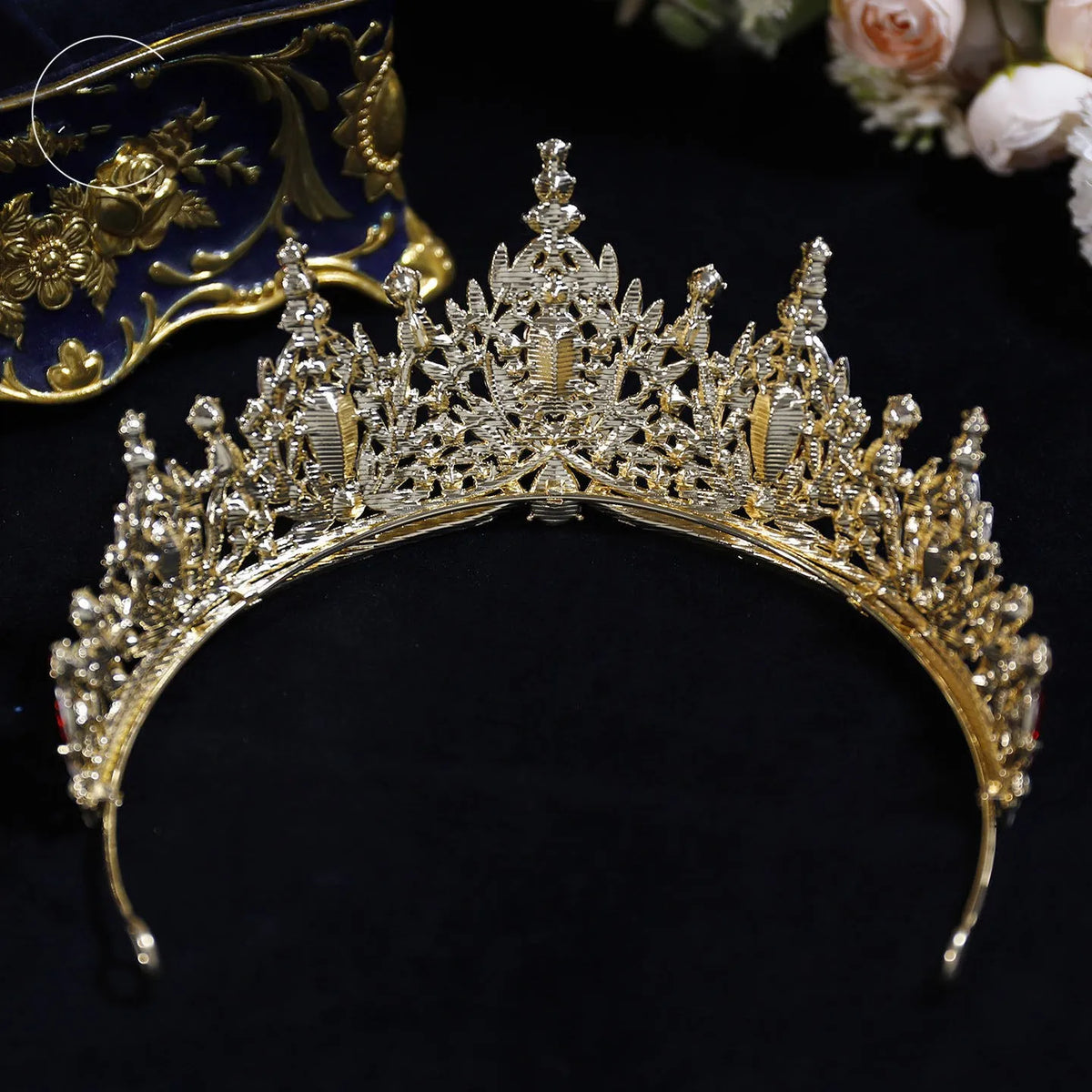 Gold-tone crown tiara with clear rhinestone detailing and tall starburst center