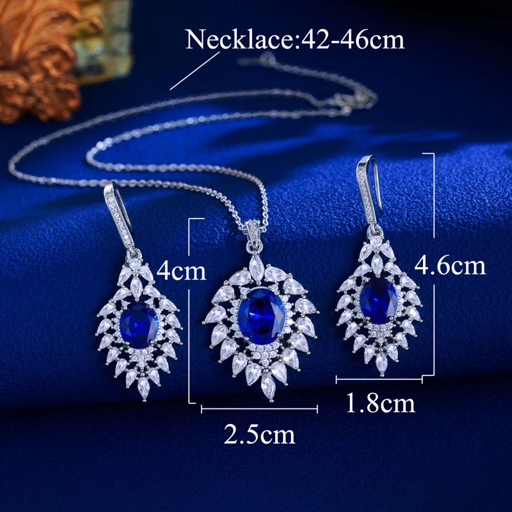 Blue CZ jewelry set with oval pendant and earrings, shown with measurements