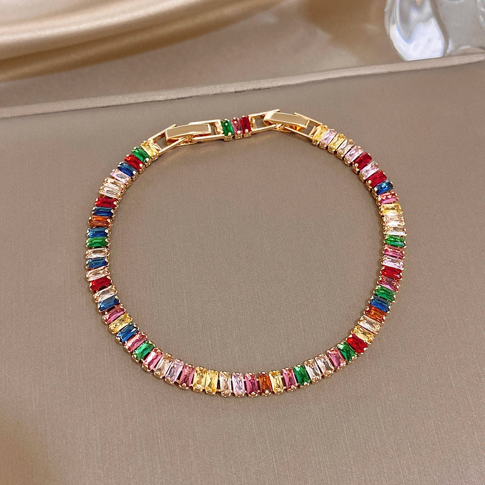Gold-tone rainbow zircon tennis bracelet with multicolor baguette stones