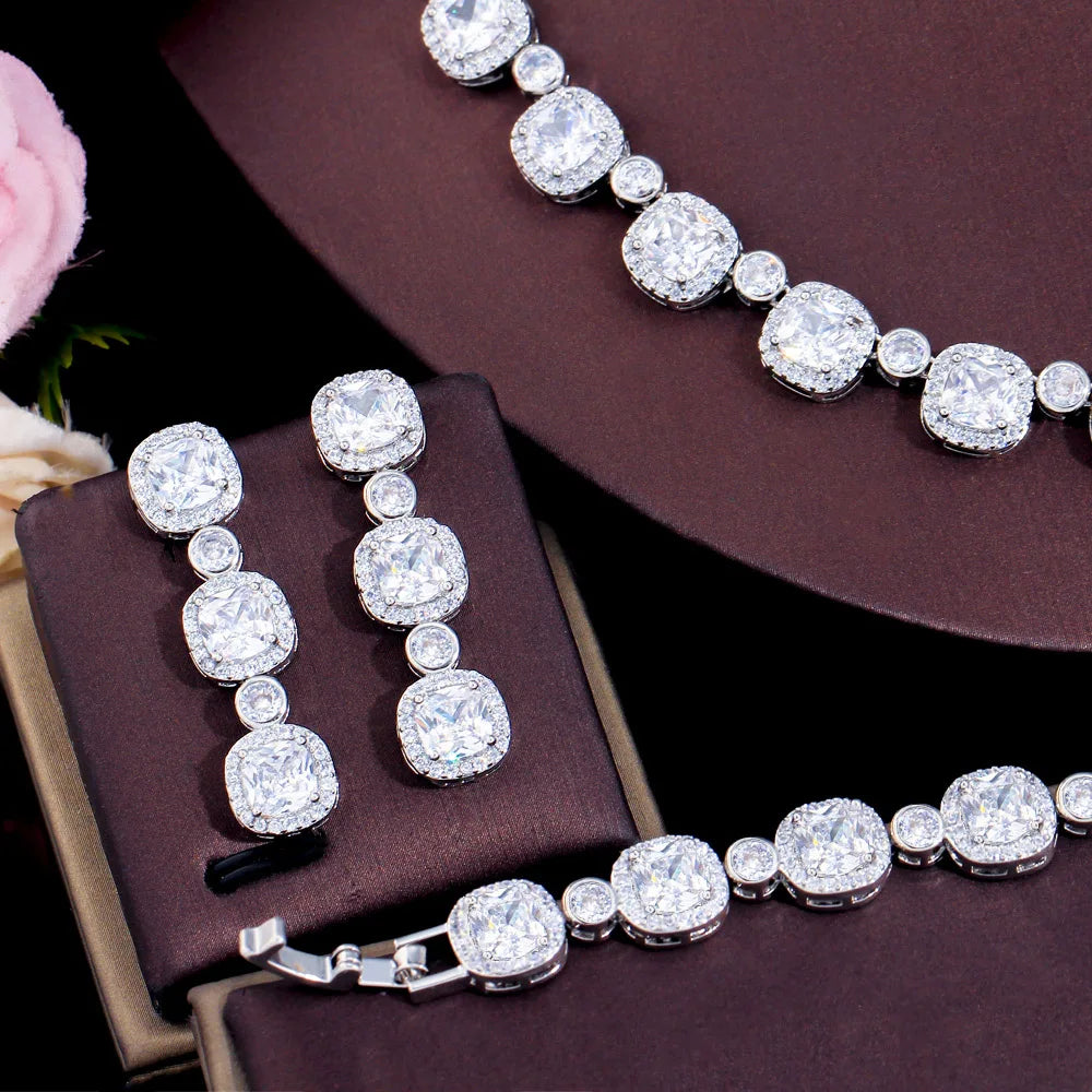 Cushion-cut cubic zirconia ring with matching bracelet and dangling earrings