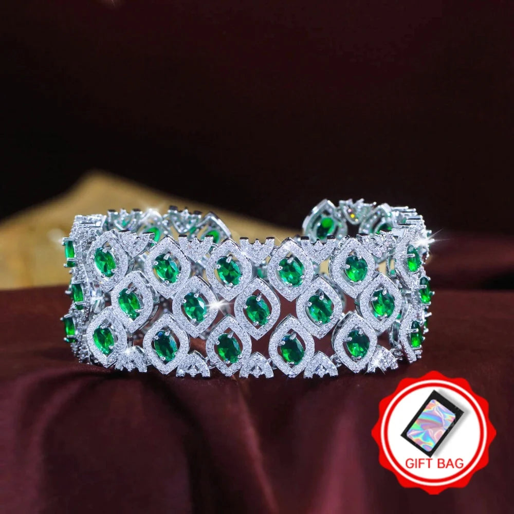 Wide silver-tone bracelet with rows of green marquise-cut zirconia stones