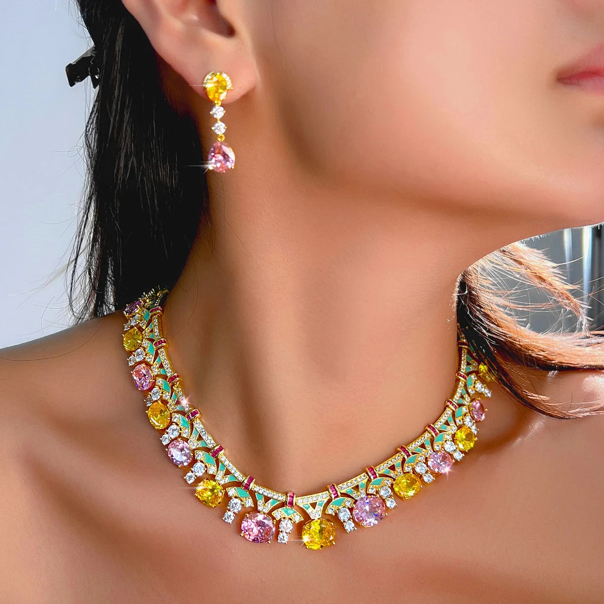 Gold-tone multicolor cubic zirconia necklace and drop earrings set, close-up on model