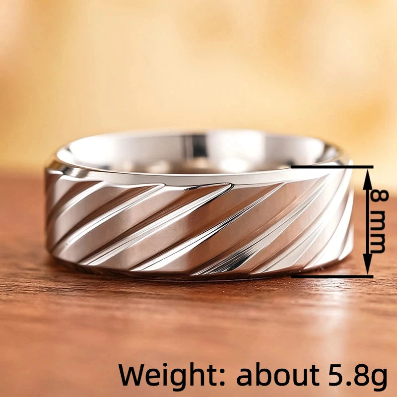 Stainless steel diagonal groove band ring with sculpted diagonal grooves and smooth top