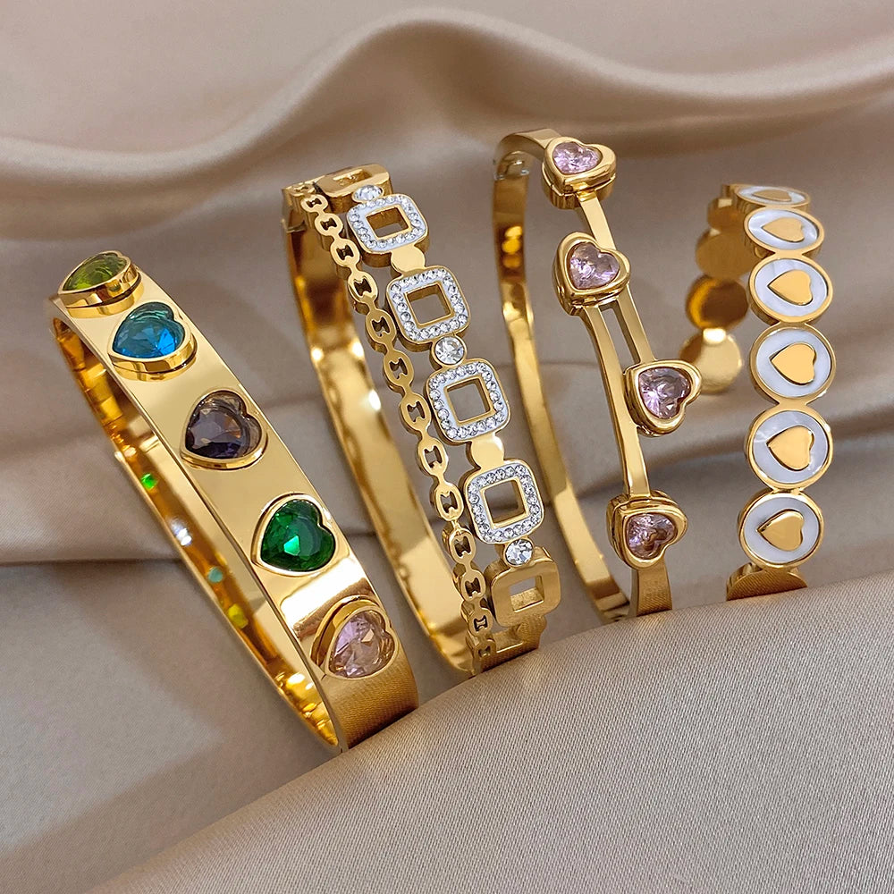 Gold-plated cuff bangle with colorful heart zircon accents, wide band