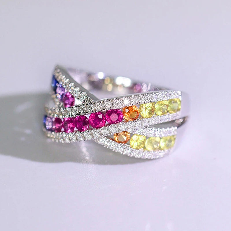 Silver-tone cross ring with multicolor CZ rows and pink center stones, full sparkle