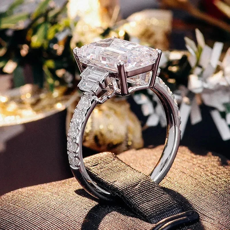 Silver zirconia eternity proposal ring with large rectangular center stone
