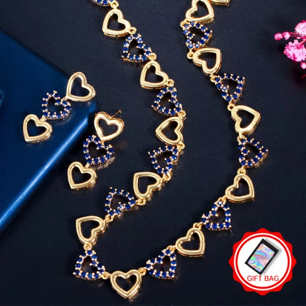 Gold-tone heart necklace and earrings with blue stones