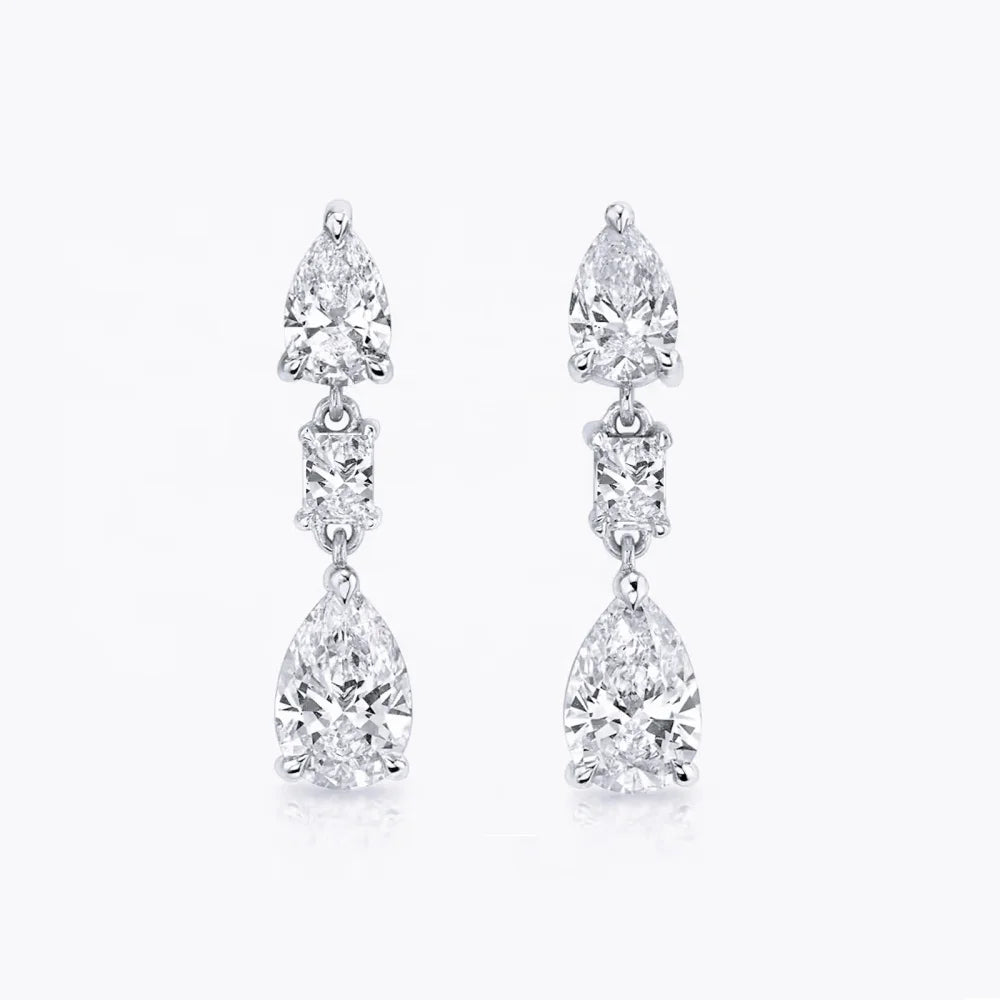 Pair of sparkling crystal drop earrings with three linked stones each.