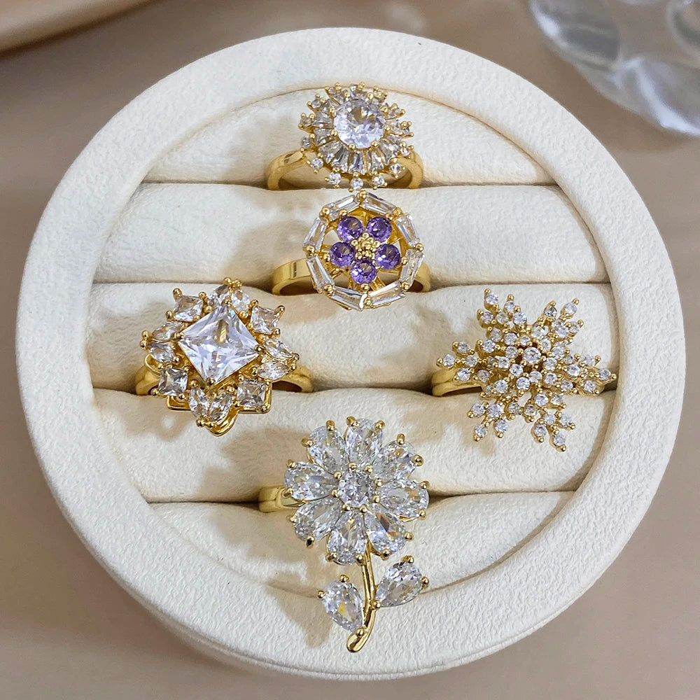 Gold-plated copper flower zirconia rings in a gift box, white and purple accents
