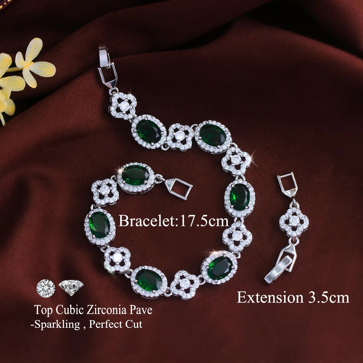 Green oval crystal flower tennis bracelet with silver-tone links and extension clasp