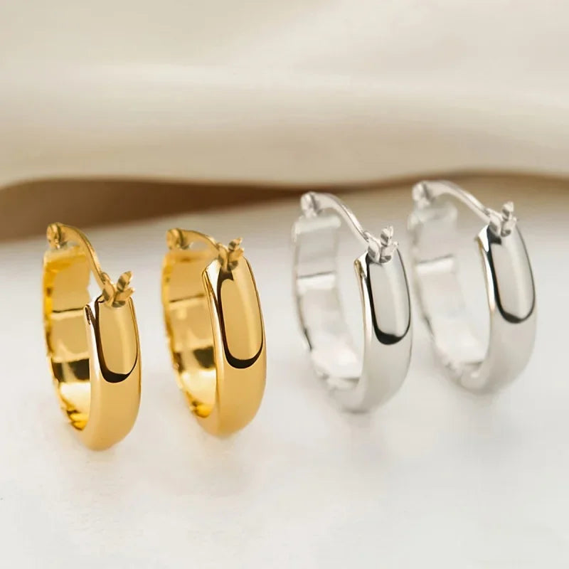 Set of gold- and silver-tone stainless steel hoop earrings, hinged round hoops