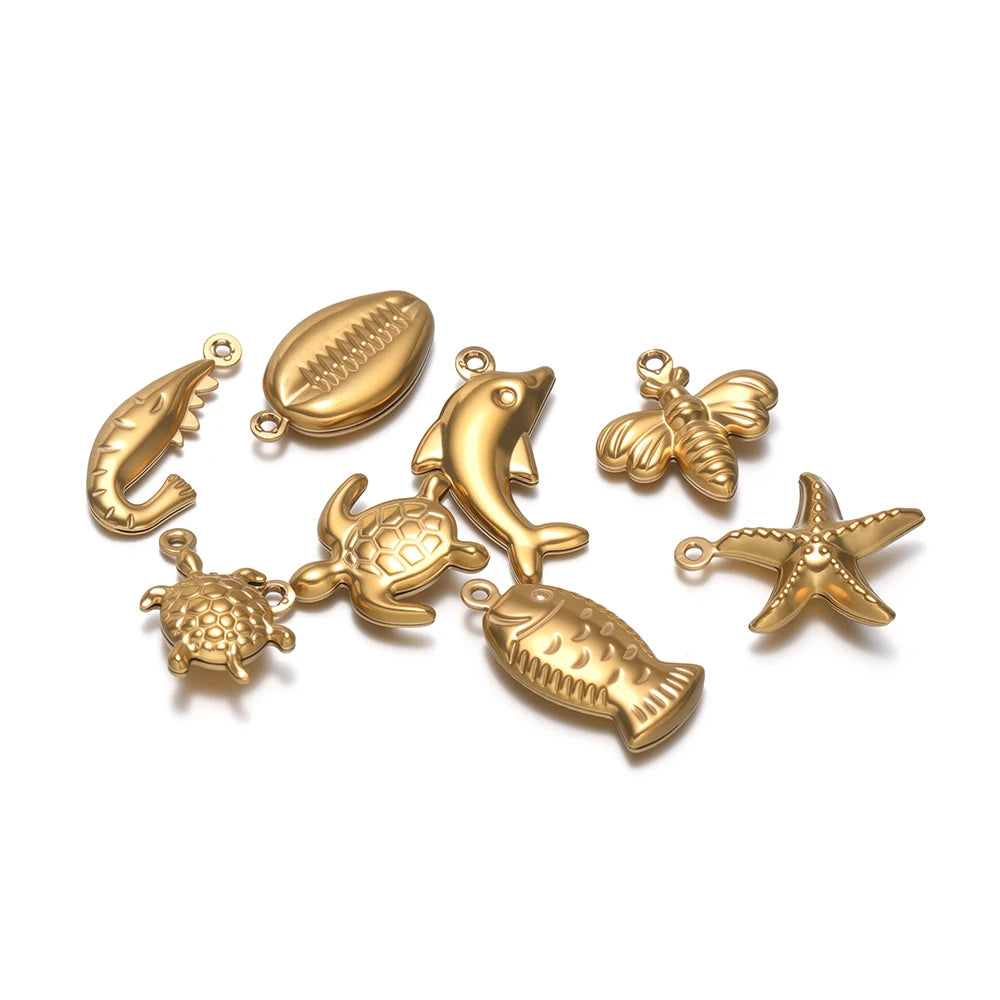 Gold-toned ocean animal hollow charms, fish, dolphin, starfish, sea turtle and crab