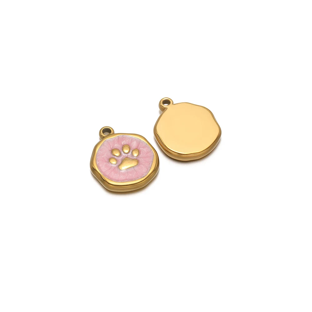 Pink enamel paw charm and plain gold-tone disc charm, each with bail loop