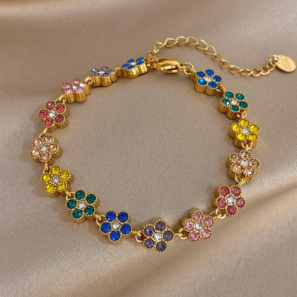 Gold-tone flower zircon bead bracelet with multicolor petals and a round extender tag