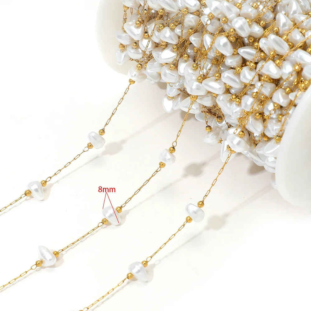 Artificial pearl chain with gold links and 8mm white oval beads
