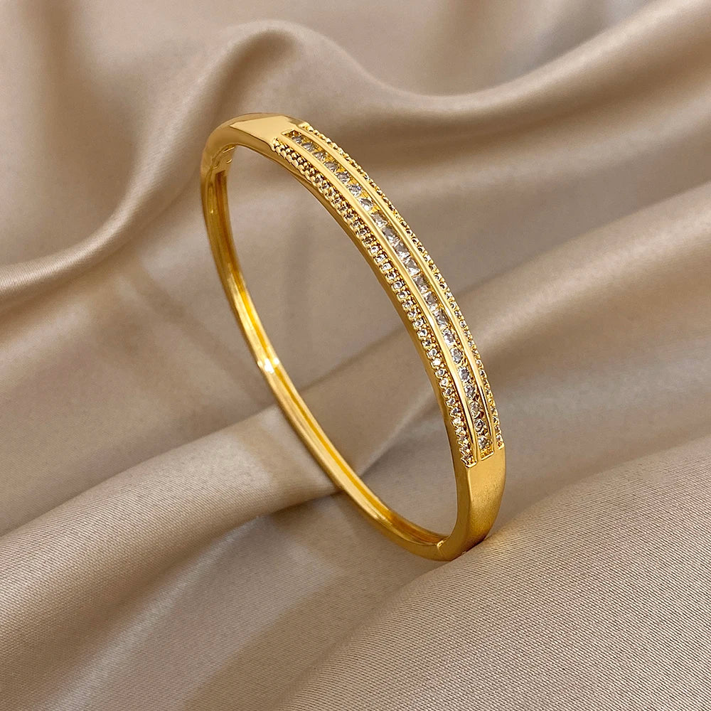 Gold-plated wide cuff bangle with micro zircon inlay and bright pave-style sparkle