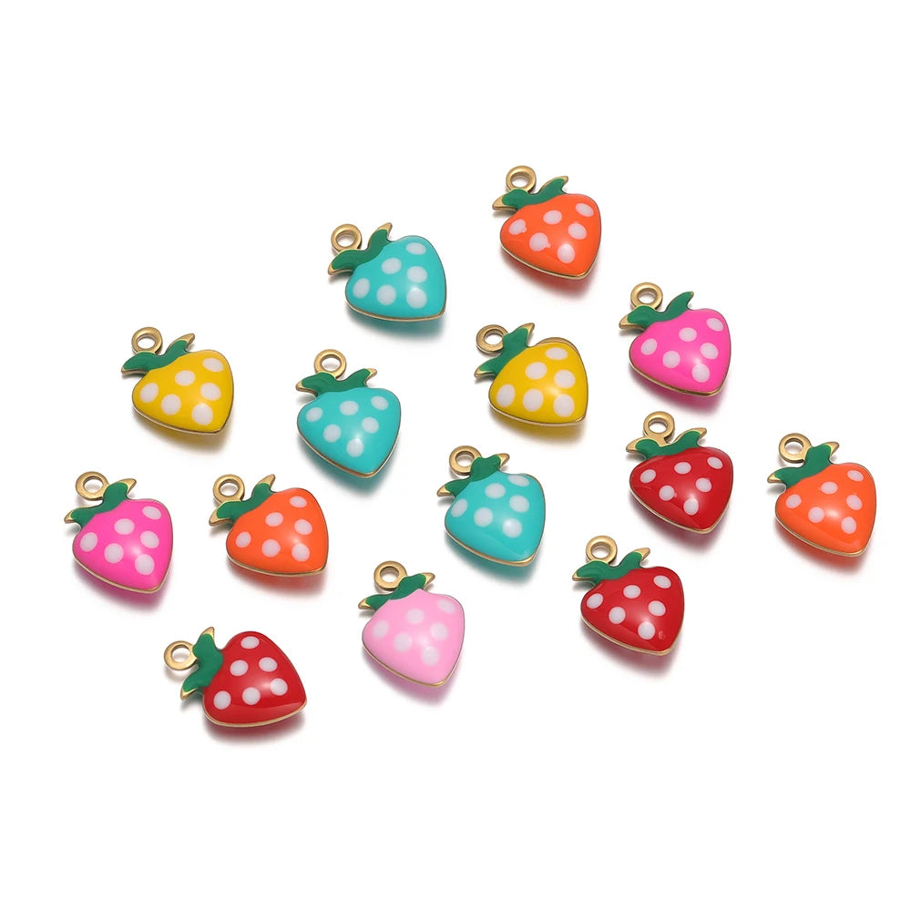 Collection of strawberry-shaped charms with gold-tone loops, glossy enamel, and white polka dots