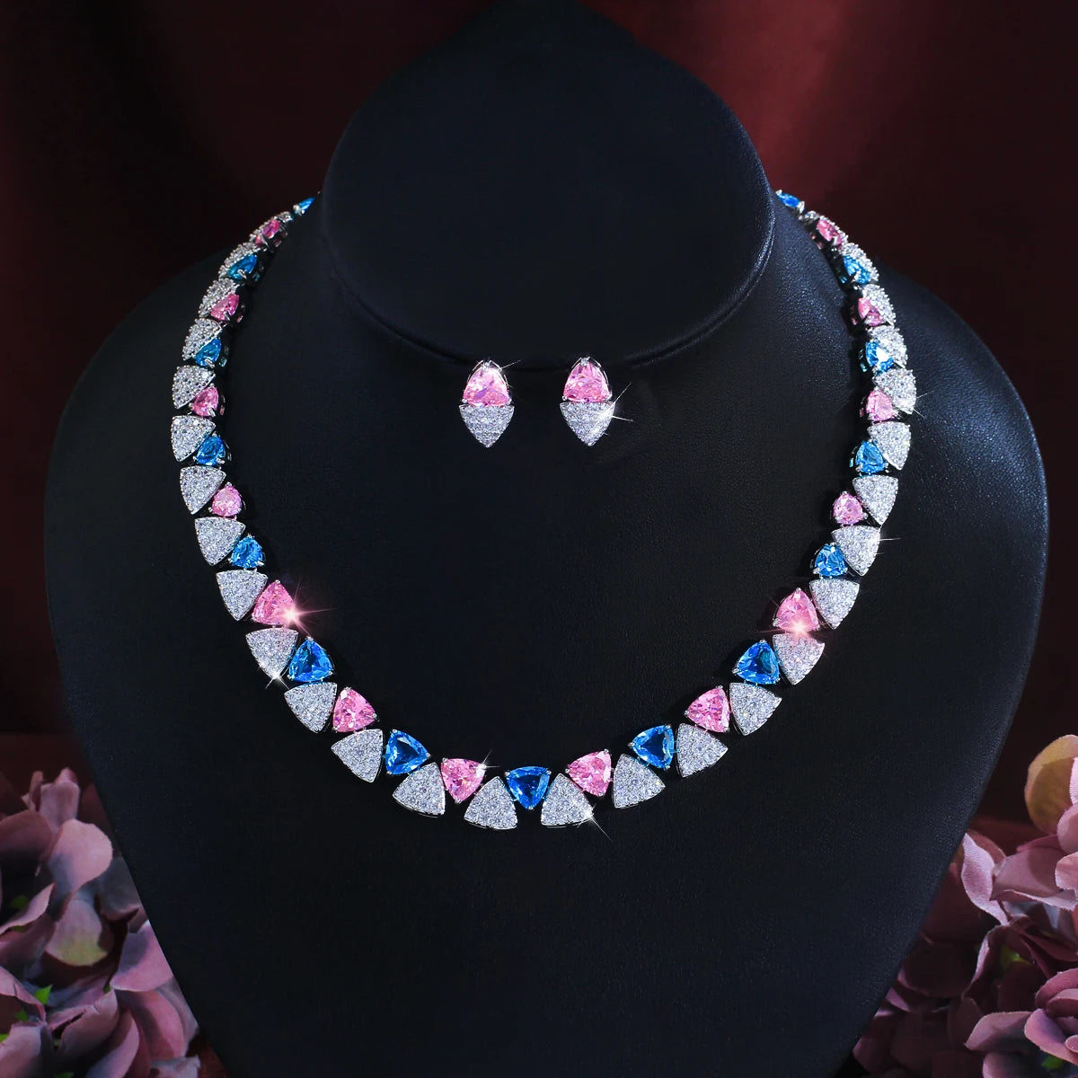 Blue, pink, and clear cubic zirconia triangle necklace and matching earrings