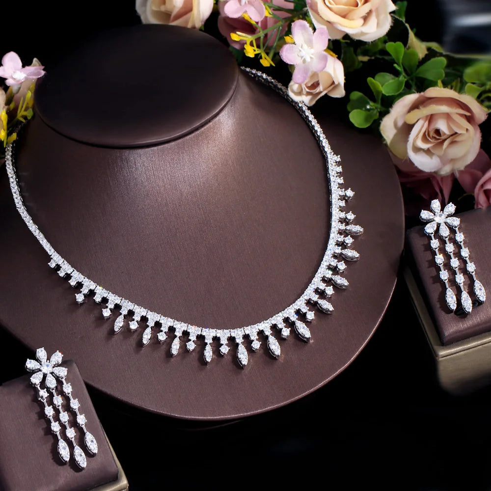Cubic zirconia fringe necklace with matching drop earrings, silver-tone on display