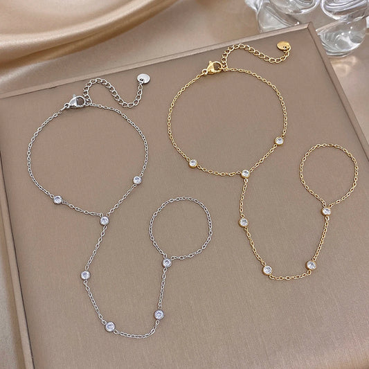 Zircon bead link bracelet set in silver and gold tones, with small round stones