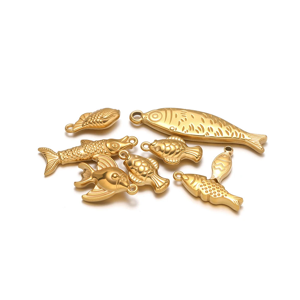 Gold-tone 3D fish charm set with five detailed fish pendants and loops