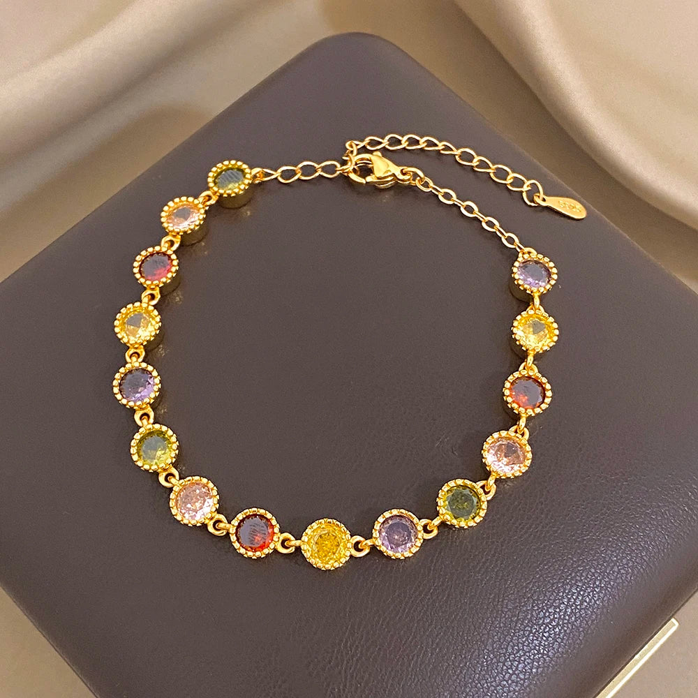 Gold-toned round zirconia bead bracelet with colorful stones and link chain
