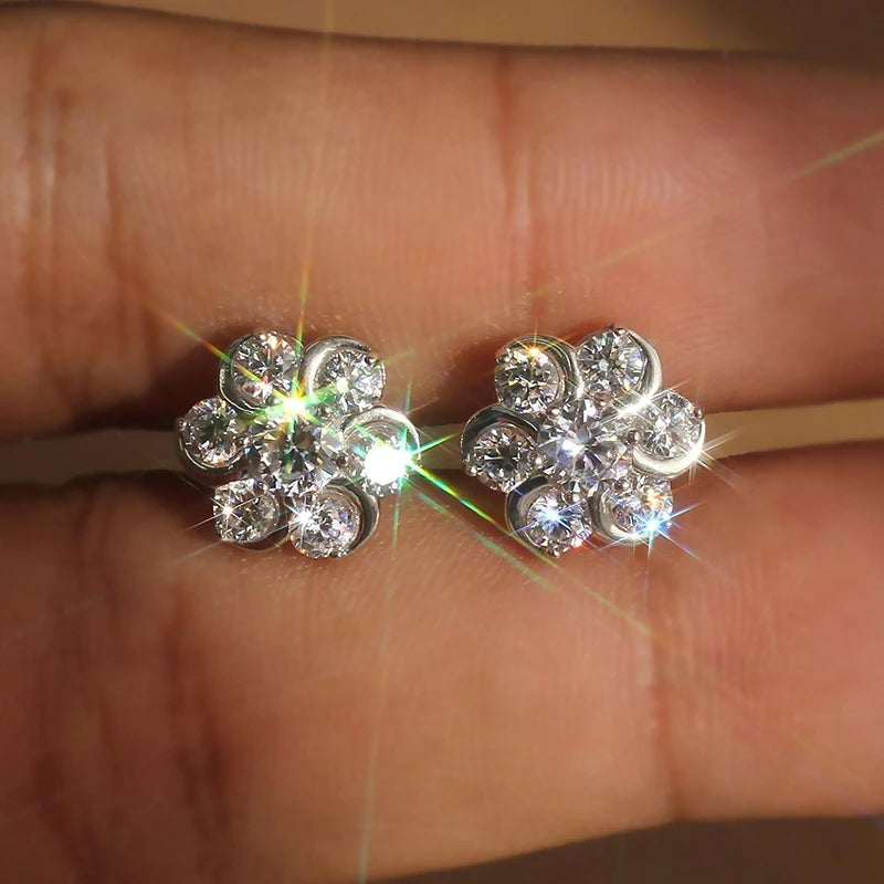 Flower-shaped cubic zirconia stud earrings, round stone clusters, silver-tone pair