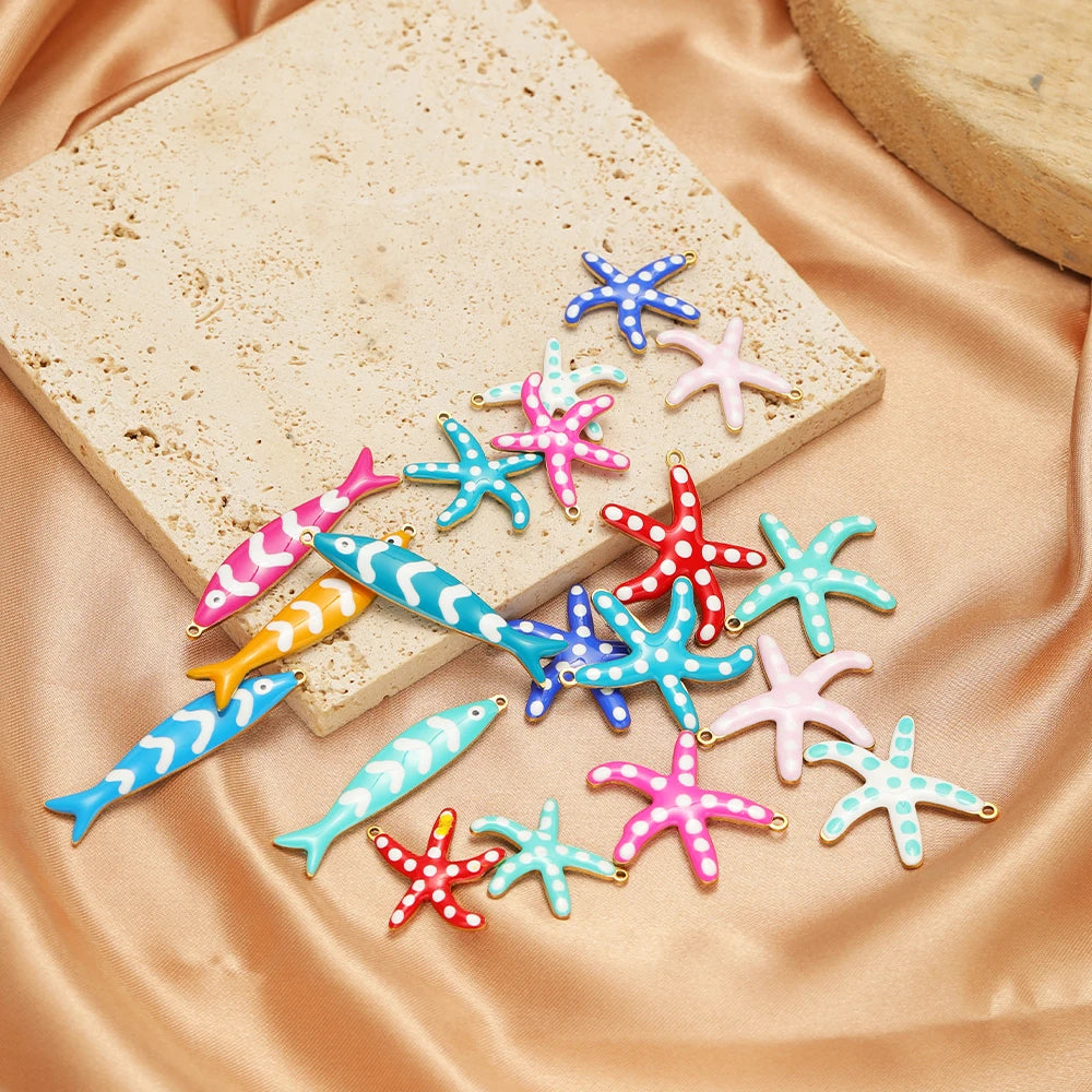 Assorted colorful fish and starfish enamel charms with gold-tone loops