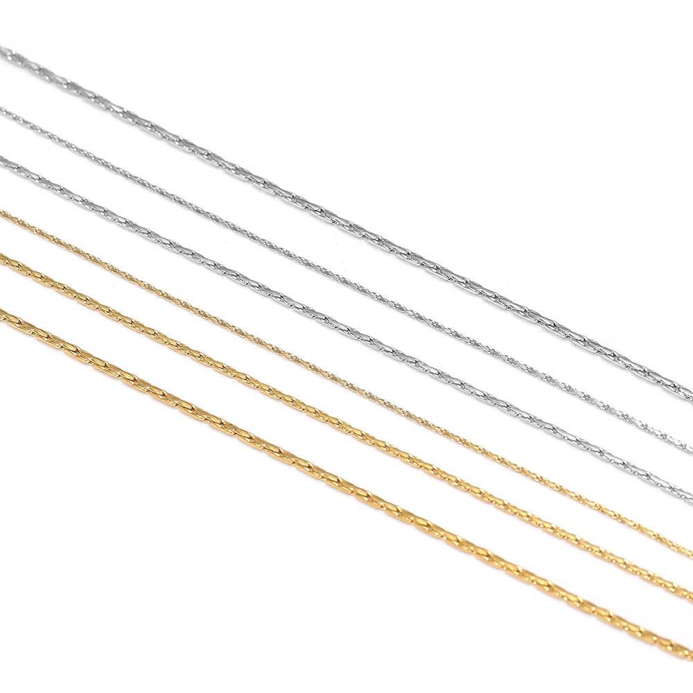 Assorted thin wire chains in silver and gold for fine jewelry making