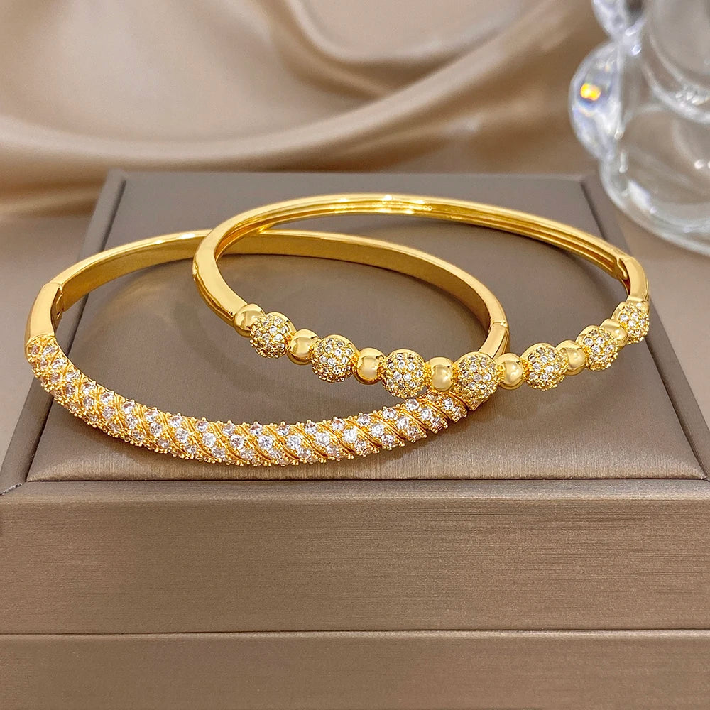 Gold-plated copper cuff bangles with zircon bead accents