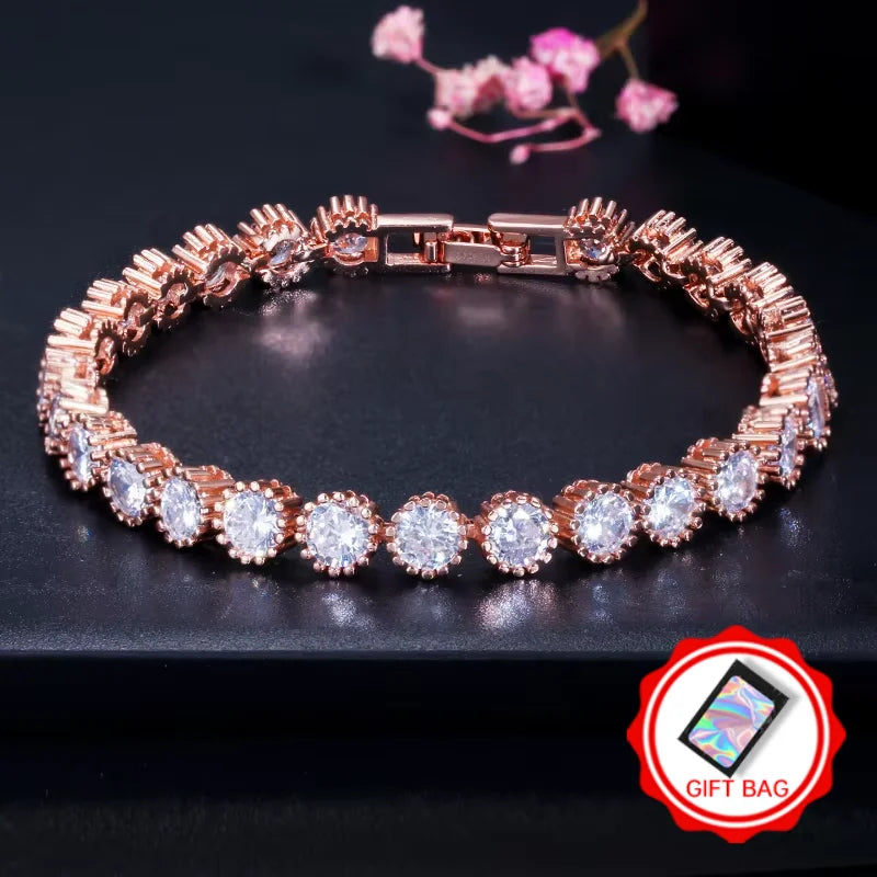 Rose gold-tone halo CZ tennis bracelet with gift bag icon
