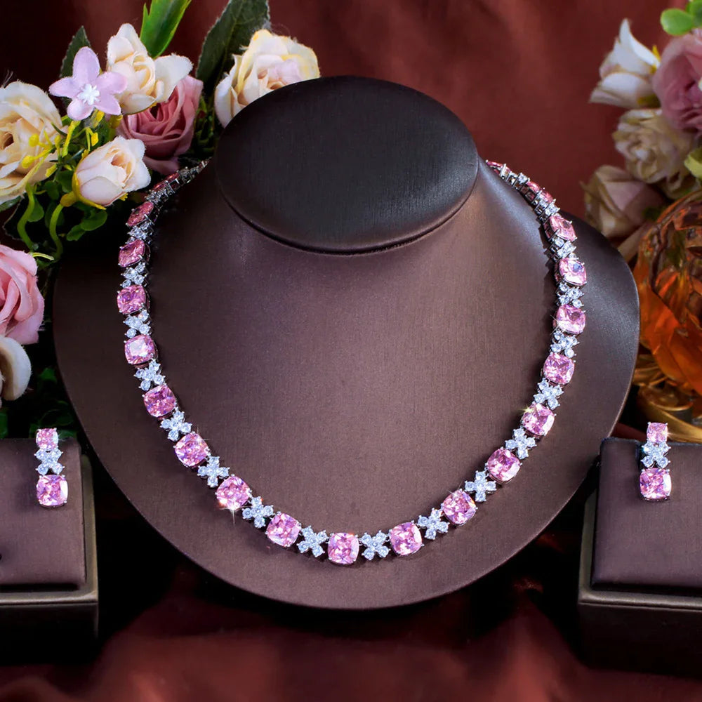 Pink square zirconia necklace and matching drop earrings set on bust with floral decor