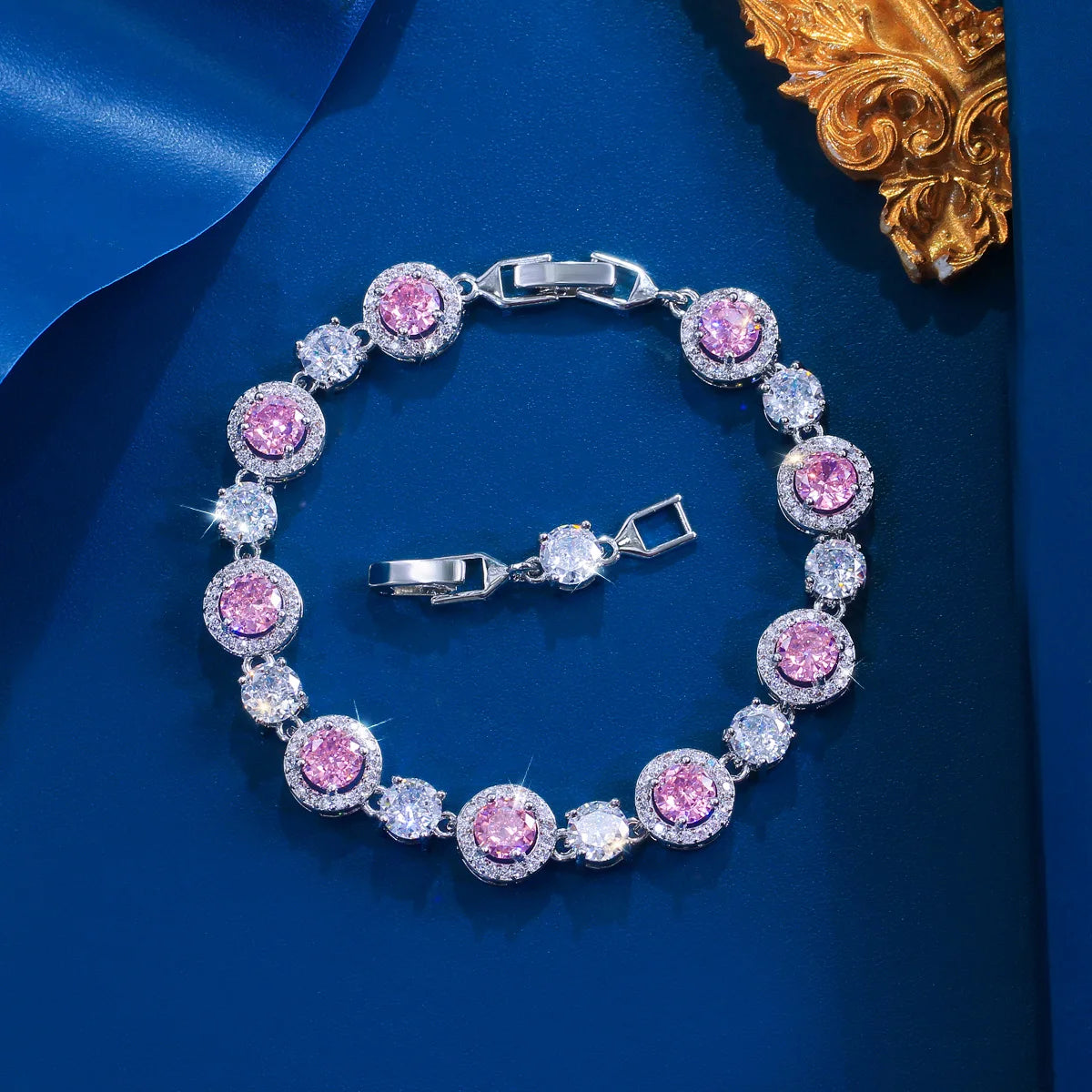 Silver-tone tennis bracelet with round pink stones alternating with clear stones